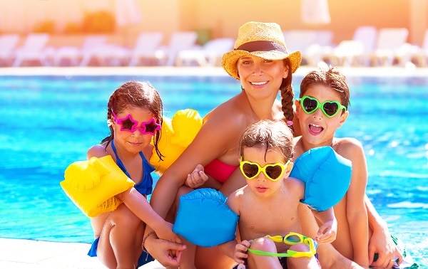 Single Mum in pool with her three children