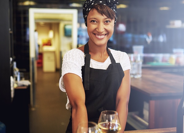 Woman working abroad in a bar