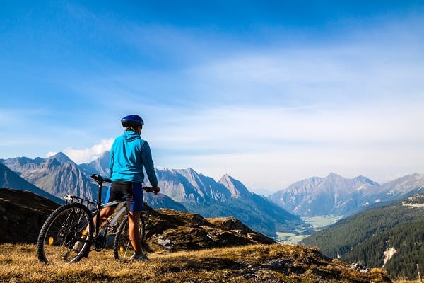 Mountain Biker Cycling over mountains