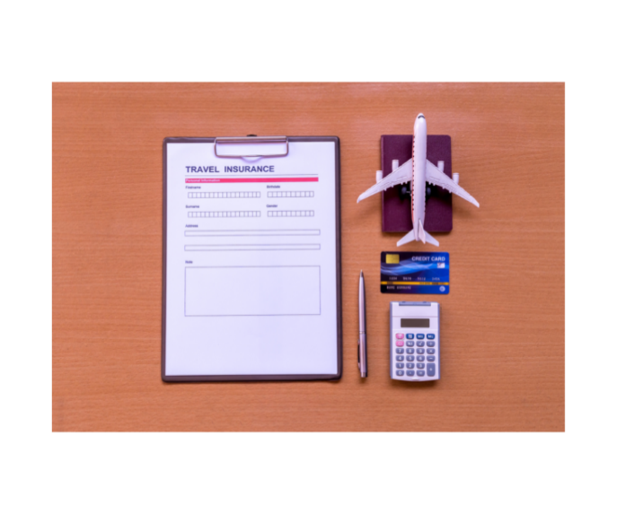 Travel insurance document on clipboard with passport, credit card, pen, calculator and toy plane next to it