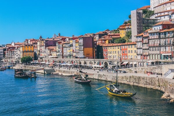 colourful buildings at the harbour with boats